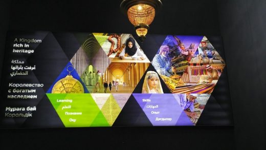 Back-lit heritage panels in a walked exhibition hall.