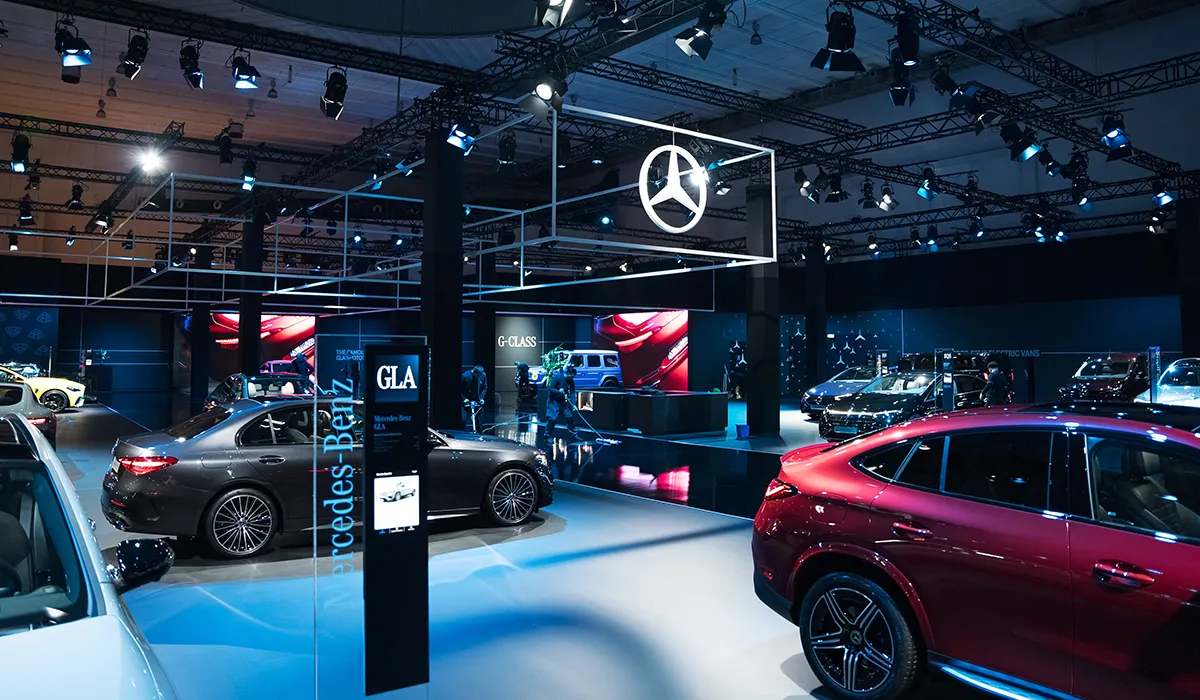 The Mercedes-Benz environment at Brussels Expo under one grid of light.
